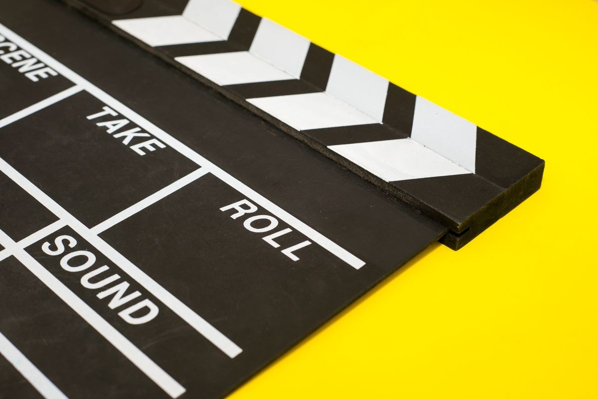 Movie clapper on a yellow background